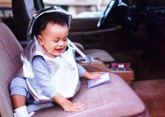 Mari plays in mom's new car