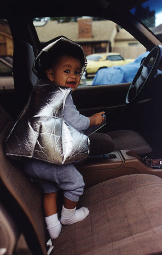 Mari plays in mom's new car