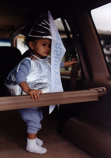 Mari plays in mom's new car