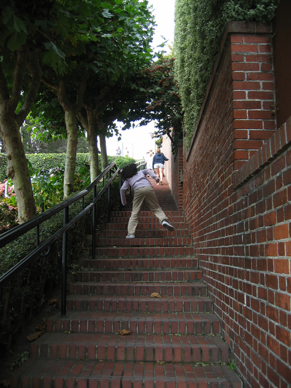 Mari walks up Lombard St.