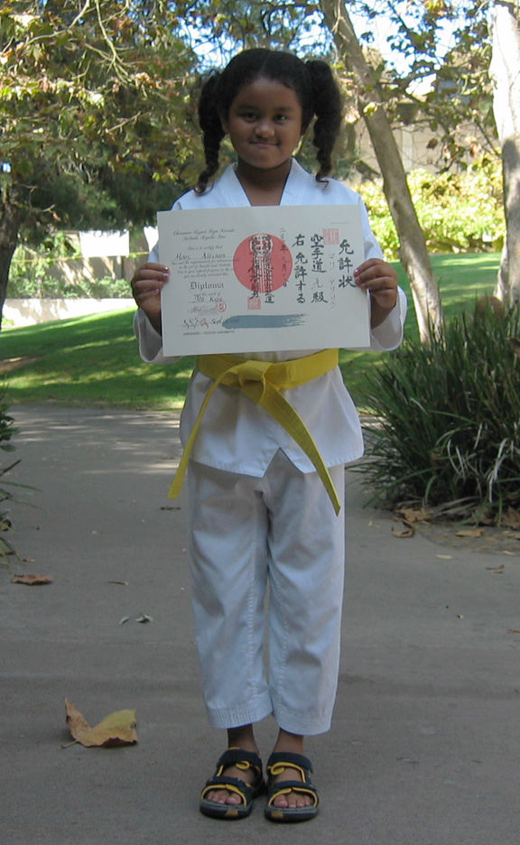 Mari displays her diploma!