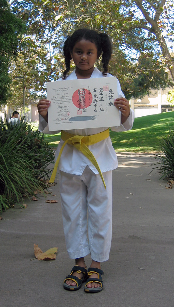 Mari displays her diploma!